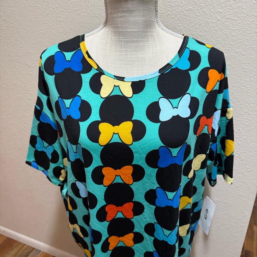 🤠 3/$20 Disney LuLaRoe - Irma - Disney Bow Print Top - Size S - NWT